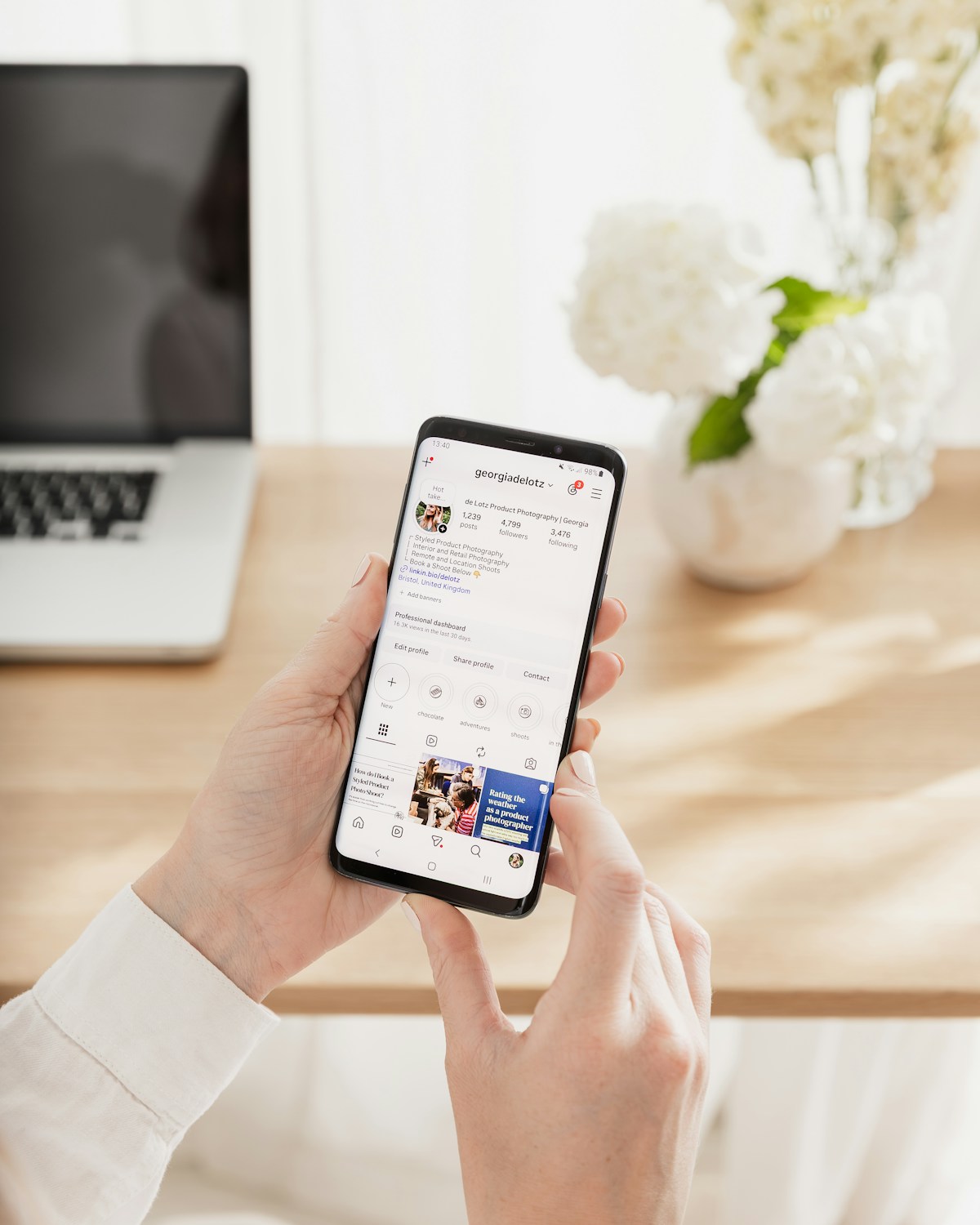 Person scrolling social media on a phone — the flat, frictionless content loop that AI can accidentally replicate